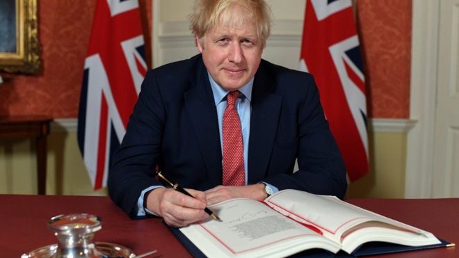 Boris Johnson signs withdrawal agreement in Downing Street